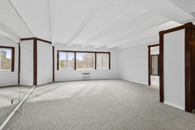 interior space featuring beamed ceiling, a wall unit AC, carpet flooring, and baseboards