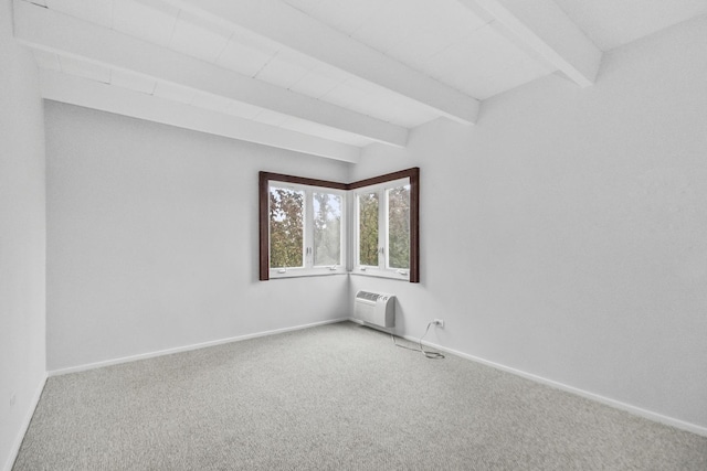 carpeted empty room featuring a wall unit AC, beamed ceiling, and baseboards