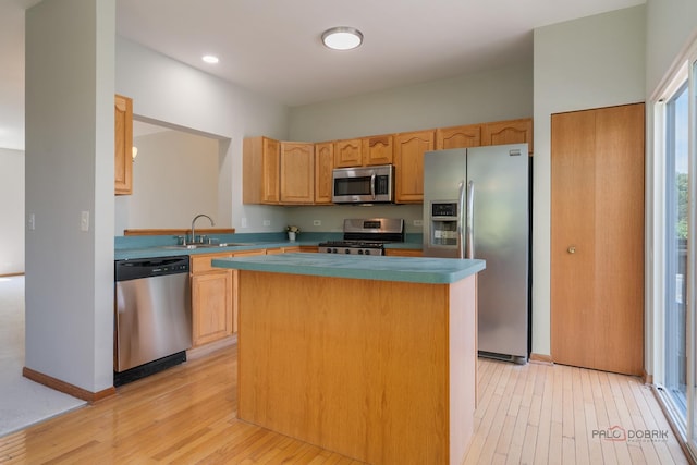 1061 Chadwick Dr, Grayslake, IL 60030 - kitchen with appliances with stainless steel finishes, light wood-style flooring, a center island, and recessed lighting