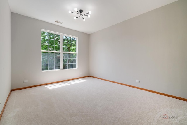 1061 Chadwick Dr, Grayslake, IL 60030 - carpeted spare room featuring baseboards and a chandelier