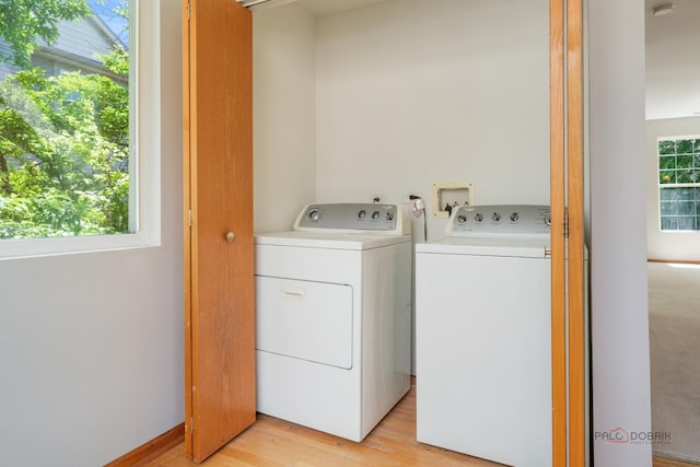 1061 Chadwick Dr, Grayslake, IL 60030 - washroom with washing machine and dryer and light wood-style flooring