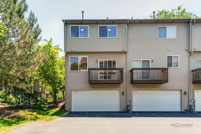 1061 Chadwick Dr, Grayslake, IL 60030 - back of property with an attached garage and driveway