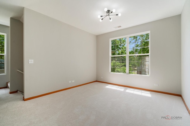 1061 Chadwick Dr, Grayslake, IL 60030 - empty room with a chandelier and light colored carpet