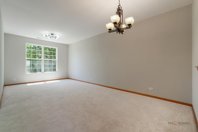 1061 Chadwick Dr, Grayslake, IL 60030 - carpeted spare room featuring a chandelier and baseboards
