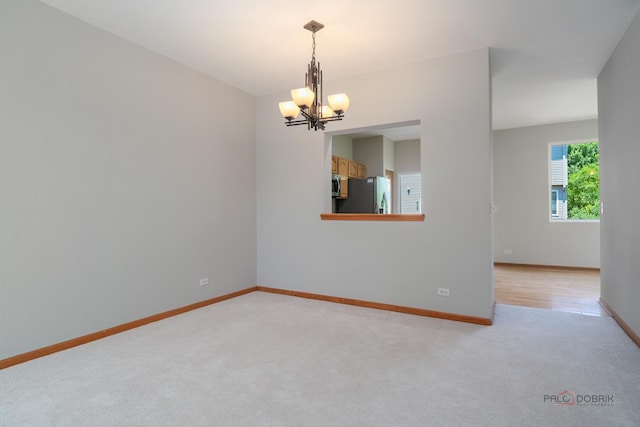 1061 Chadwick Dr, Grayslake, IL 60030 - empty room with a chandelier and light carpet