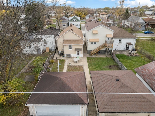 birds eye view of property with a residential view