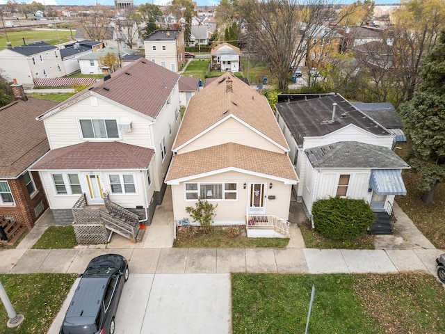 birds eye view of property with a residential view