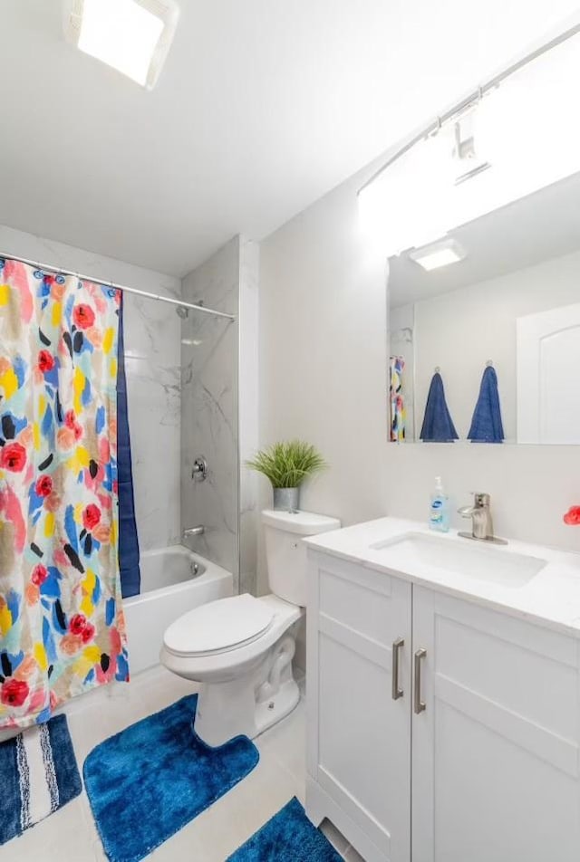 full bathroom featuring shower / bath combo, vanity, and toilet