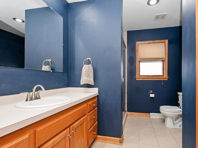 full bathroom with visible vents, toilet, a shower stall, tile patterned flooring, and vanity