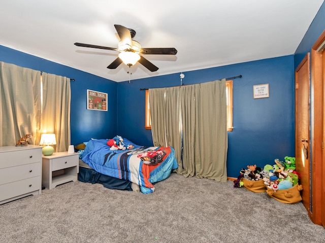 carpeted bedroom featuring a ceiling fan