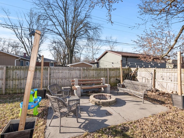 view of patio / terrace with a fenced backyard and an outdoor fire pit