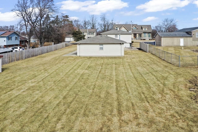 view of yard featuring a residential view and fence