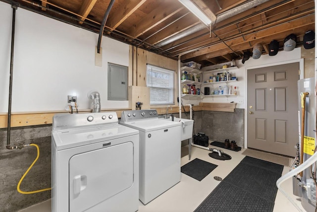 washroom featuring laundry area, washer and clothes dryer, and electric panel