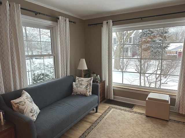 sitting room featuring ornamental molding, wood finished floors, and visible vents