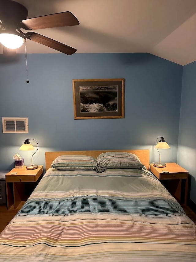 bedroom featuring vaulted ceiling and ceiling fan