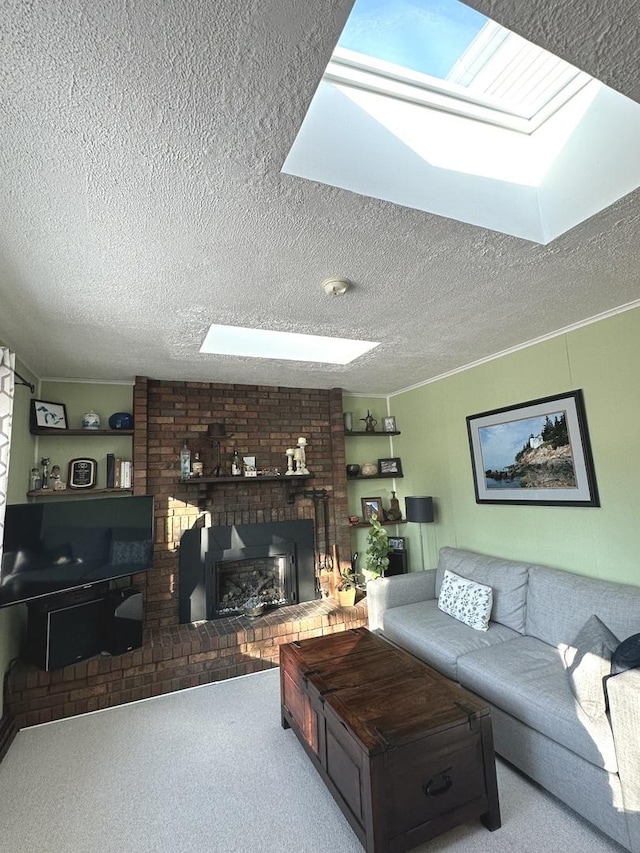 carpeted living area with a skylight, a fireplace, and a textured ceiling