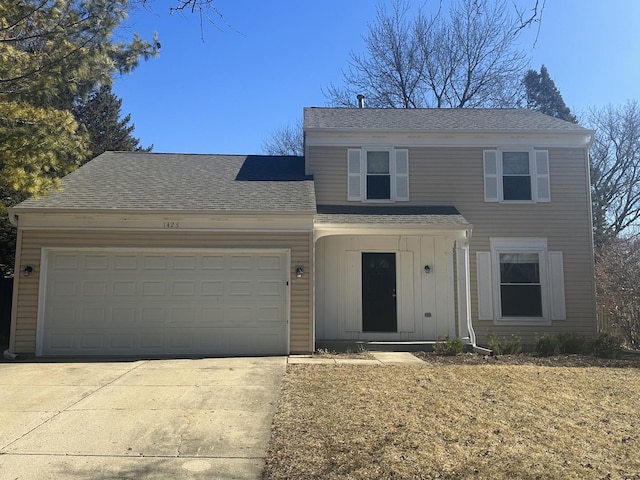 view of front of house featuring a garage, board and batten siding, concrete driveway, and roof with shingles