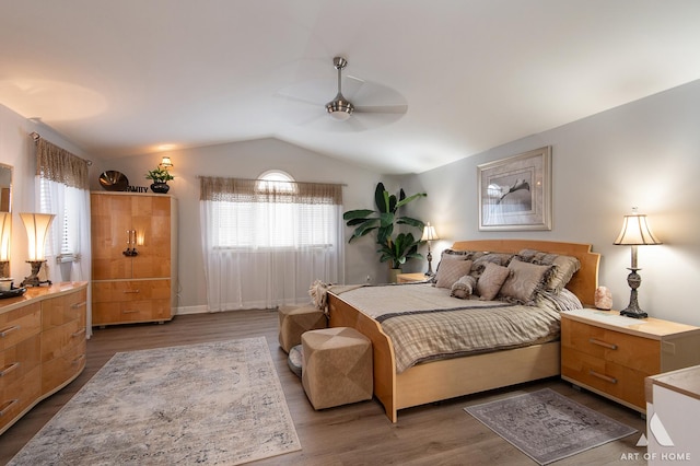 bedroom featuring vaulted ceiling, wood finished floors, and a ceiling fan