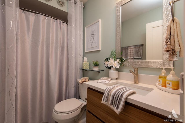 full bathroom featuring toilet and vanity