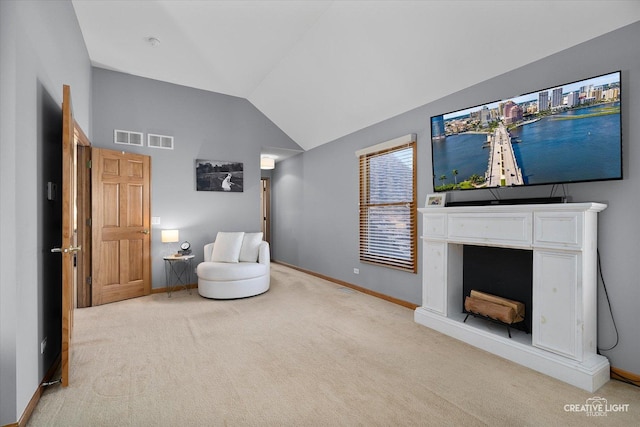 sitting room featuring carpet floors, a fireplace, visible vents, baseboards, and vaulted ceiling