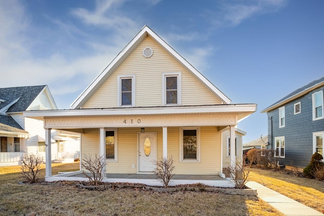 country-style home featuring a porch