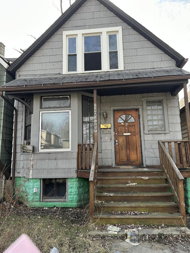 view of front of home featuring a shingled roof