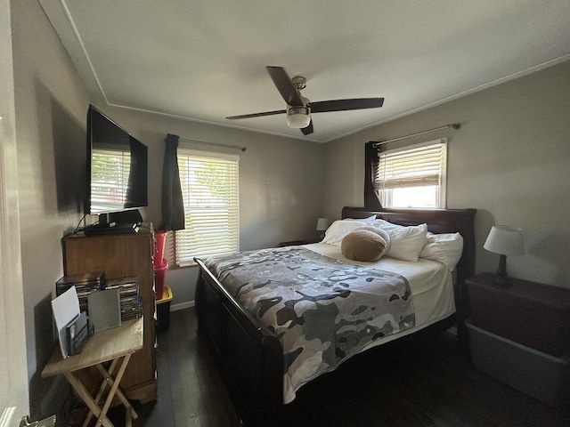 bedroom featuring dark wood-type flooring and a ceiling fan