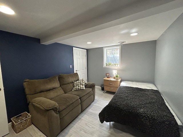 bedroom with recessed lighting and light wood-style flooring