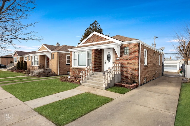 bungalow-style home featuring an outbuilding, a garage, brick siding, crawl space, and a front lawn