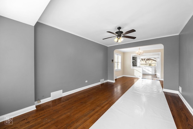 unfurnished living room featuring visible vents, baseboards, ornamental molding, dark wood-type flooring, and ceiling fan with notable chandelier