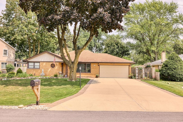 ranch-style house with a garage, driveway, fence, a front yard, and brick siding