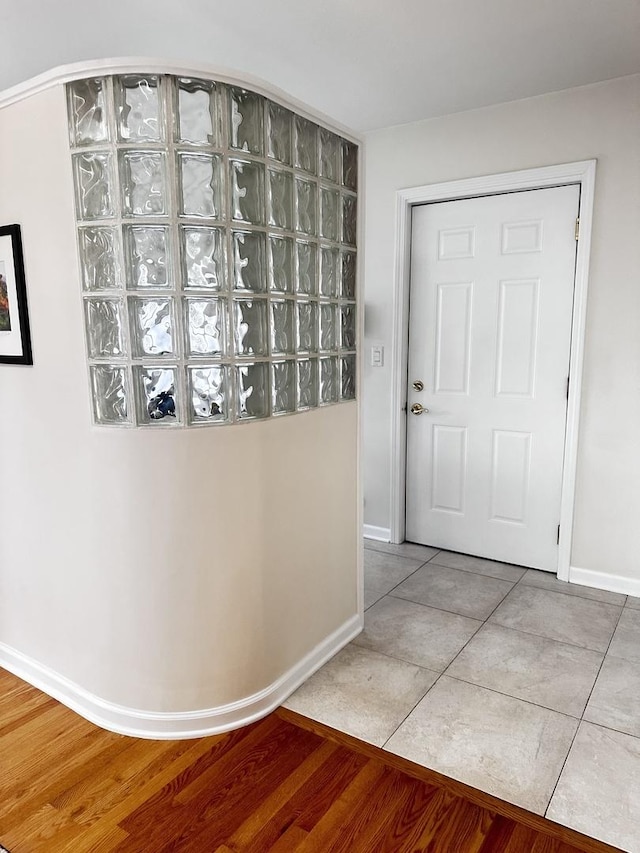 interior space featuring baseboards