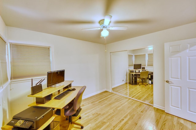 home office with ceiling fan, light wood finished floors, and baseboards