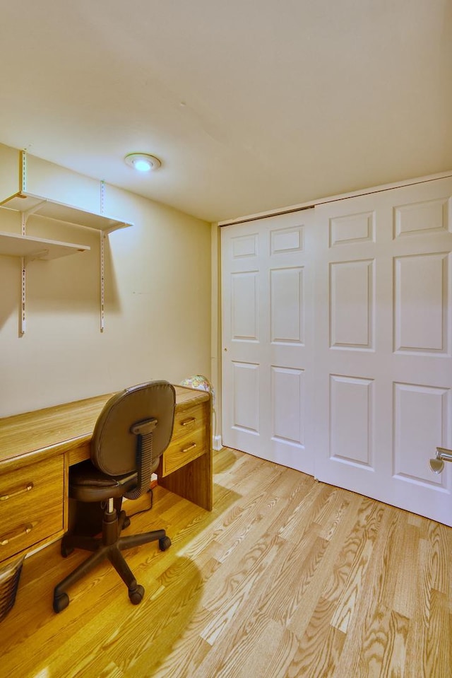 home office with light wood-style floors