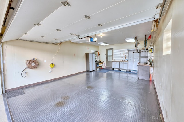 garage featuring baseboards and a garage door opener