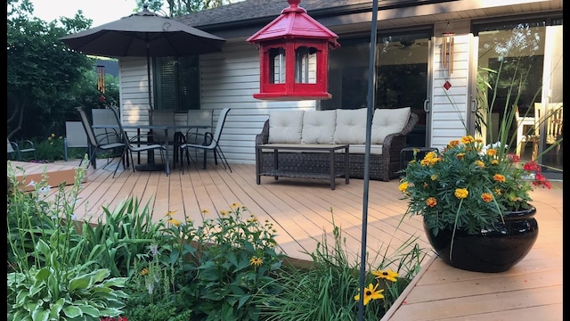 wooden deck featuring an outdoor hangout area and outdoor dining area