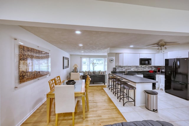 dining space with light tile patterned flooring, baseboards, a ceiling fan, and recessed lighting