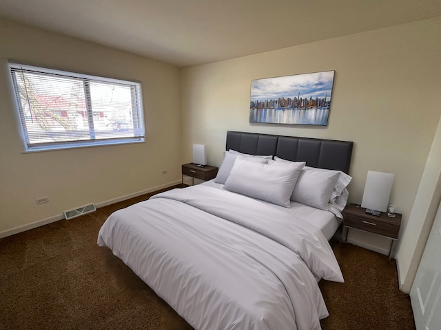 carpeted bedroom with baseboards and visible vents