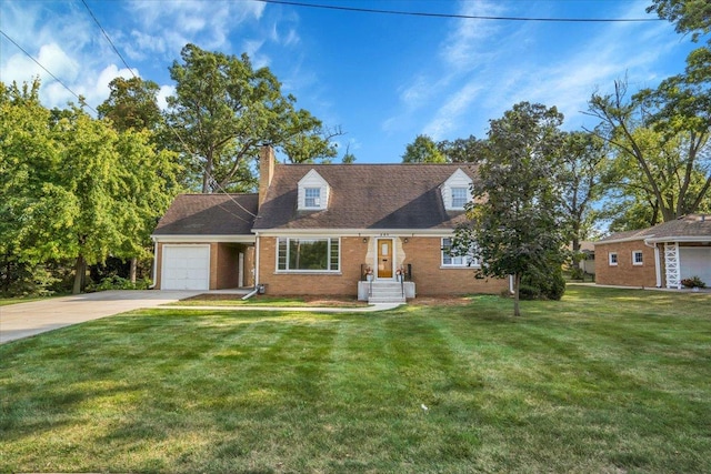 new england style home featuring brick siding, a chimney, concrete driveway, a garage, and a front lawn