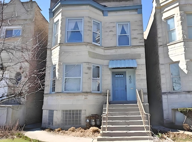 view of exterior entry with stone siding