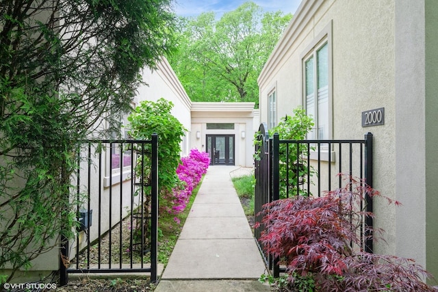 2000 Clendenin Ln, Riverwoods, IL 60015 - property entrance featuring stucco siding, french doors, and a gate