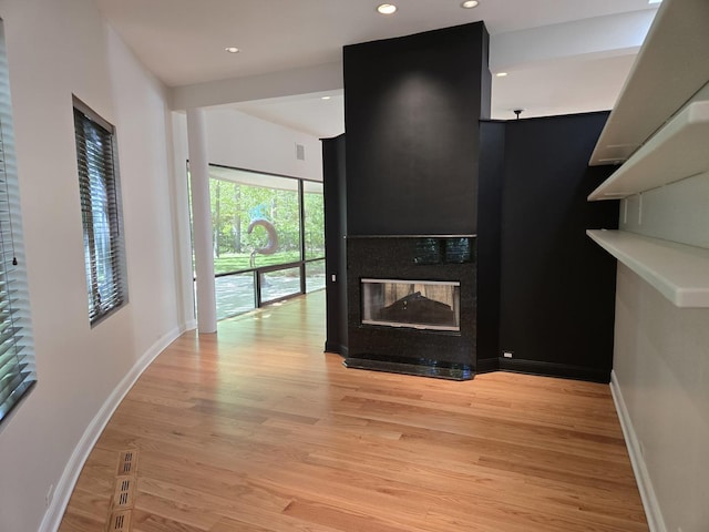 2000 Clendenin Ln, Riverwoods, IL 60015 - kitchen featuring light wood-style flooring, a multi sided fireplace, recessed lighting, and light countertops