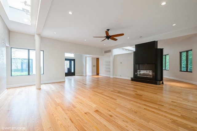 2000 Clendenin Ln, Riverwoods, IL 60015 - unfurnished living room with healthy amount of natural light, ceiling fan, light wood-type flooring, and recessed lighting