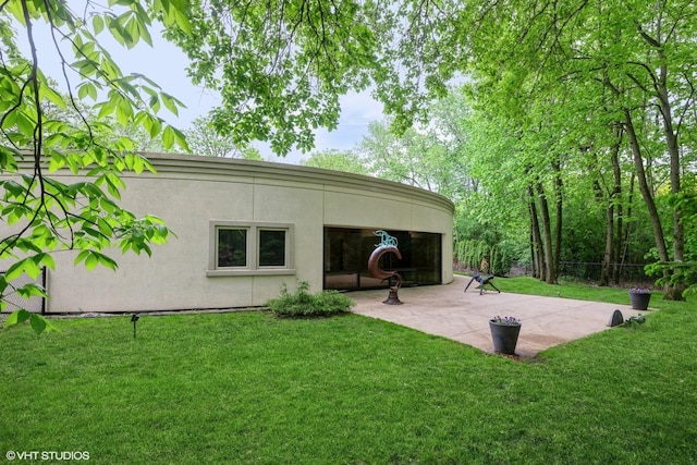 2000 Clendenin Ln, Riverwoods, IL 60015 - rear view of property with stucco siding, a lawn, and a patio area
