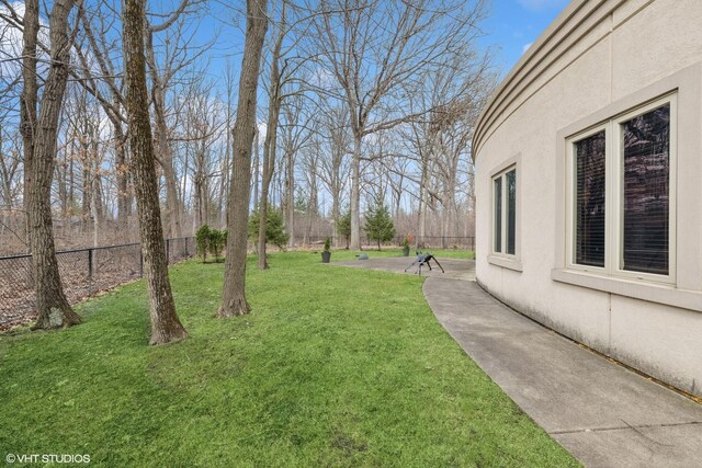 view of yard with a patio and fence