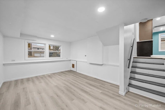 interior space featuring stairs, recessed lighting, wood finished floors, and baseboards