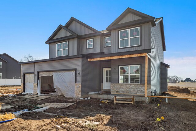 605 Wheatley Dr, Mahomet, IL 61853 - view of front facade with stone siding and a garage