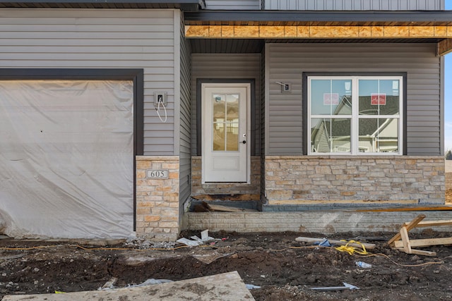 605 Wheatley Dr, Mahomet, IL 61853 - property entrance with stone siding