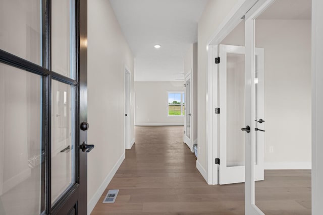 605 Wheatley Dr, Mahomet, IL 61853 - hall with wood finished floors, baseboards, and recessed lighting