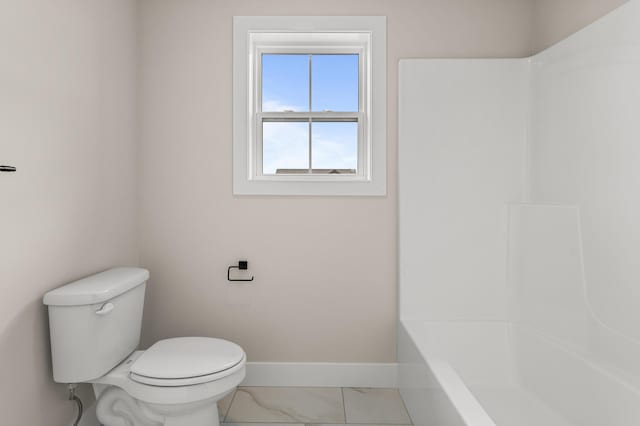 605 Wheatley Dr, Mahomet, IL 61853 - full bath featuring baseboards, toilet, marble finish flooring, and shower / tub combination